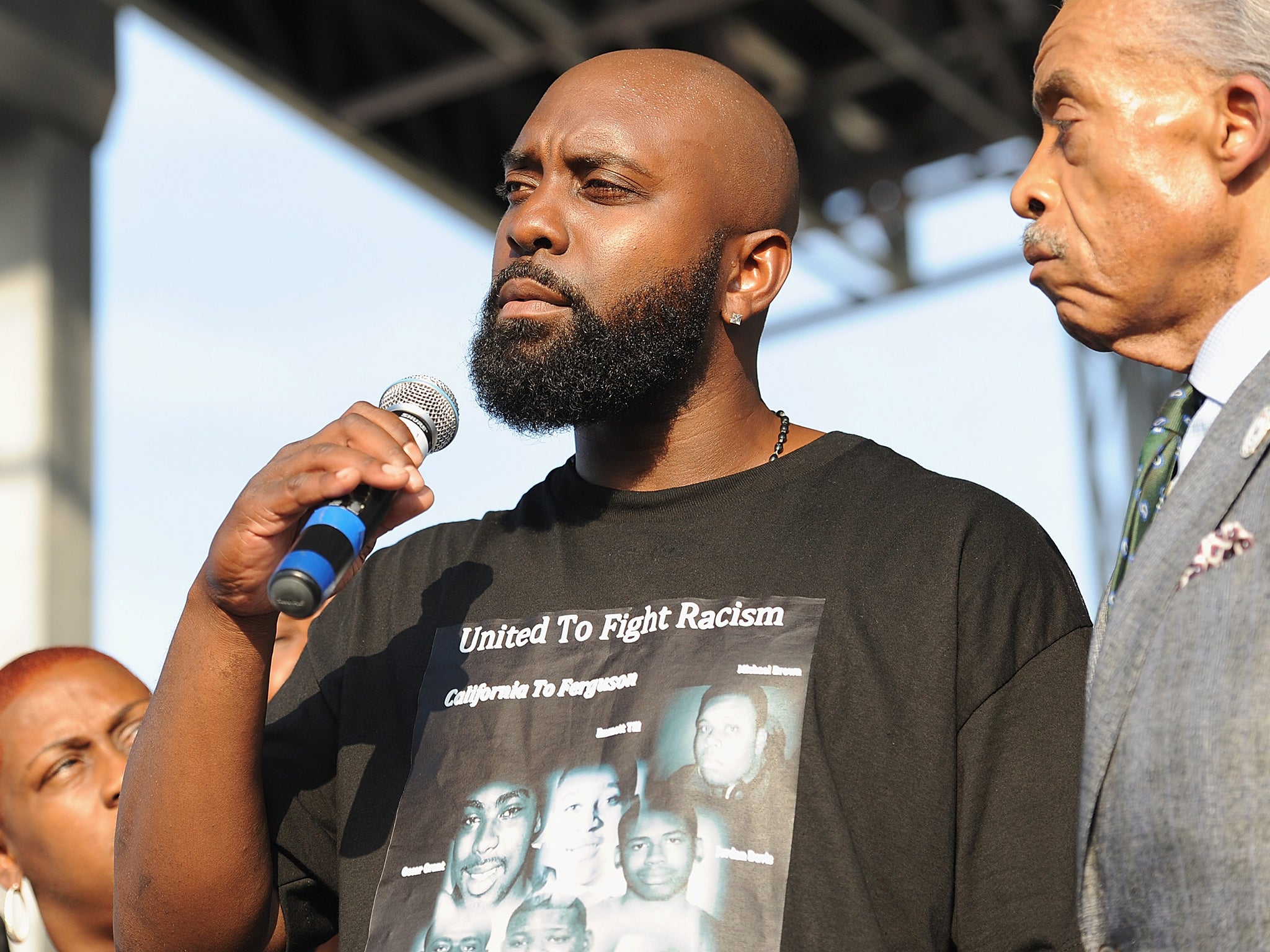 Michael Brown Sr., father of slain teenager Michael Brown Jr., speaks to the crowd during Peacefest, hosted by Better Family Life and the Trayvon Martin Foundation in St. Louis, Missouri on August 24, 2014. The festival is held in support for the family