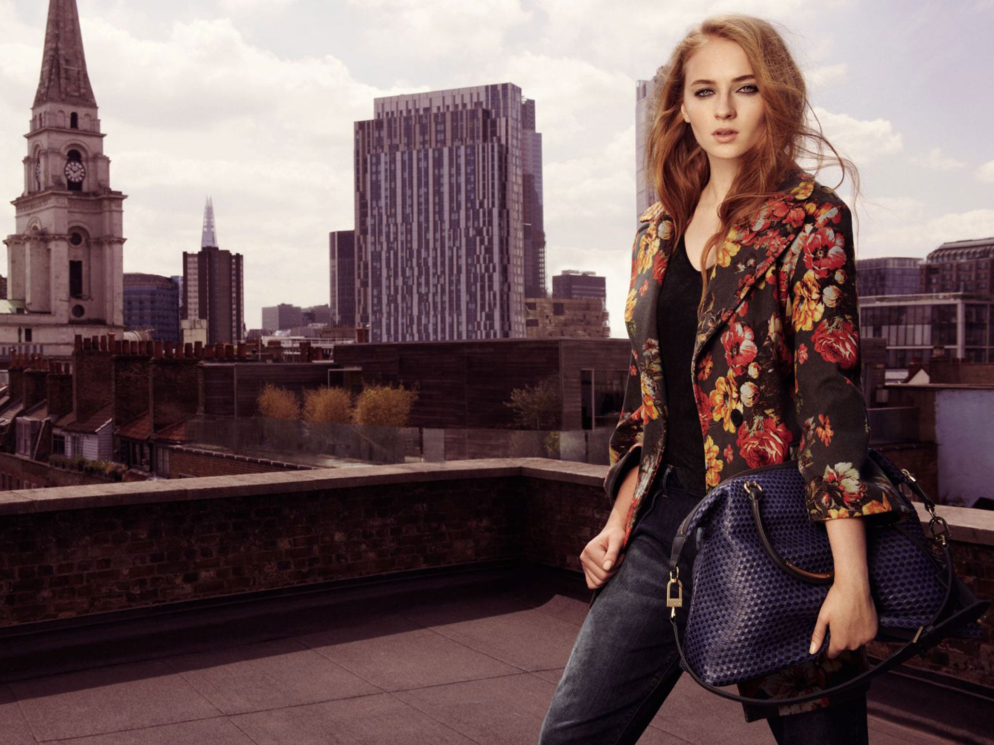 Sophie Turner wears jeans £99, floral coat £299, t-shirt £65, bag £399; karenmillen.co.uk