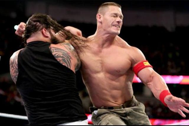 John Cena clotheslines Bray Wyatt during WWE Raw on Monday night