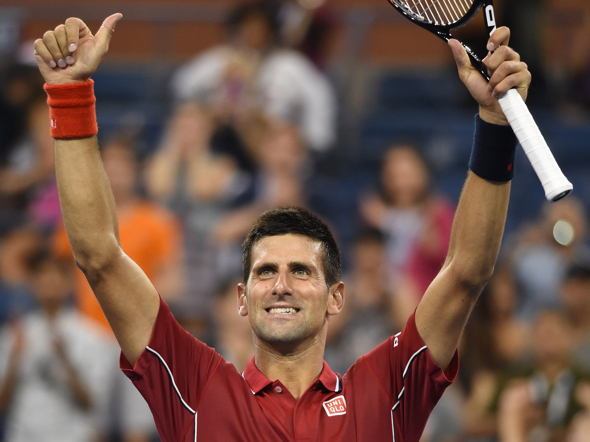 Novak Djokovic of Serbia celebratee his win over Diego Schwartzman of Argentina during their US Open 2014 men's singles match