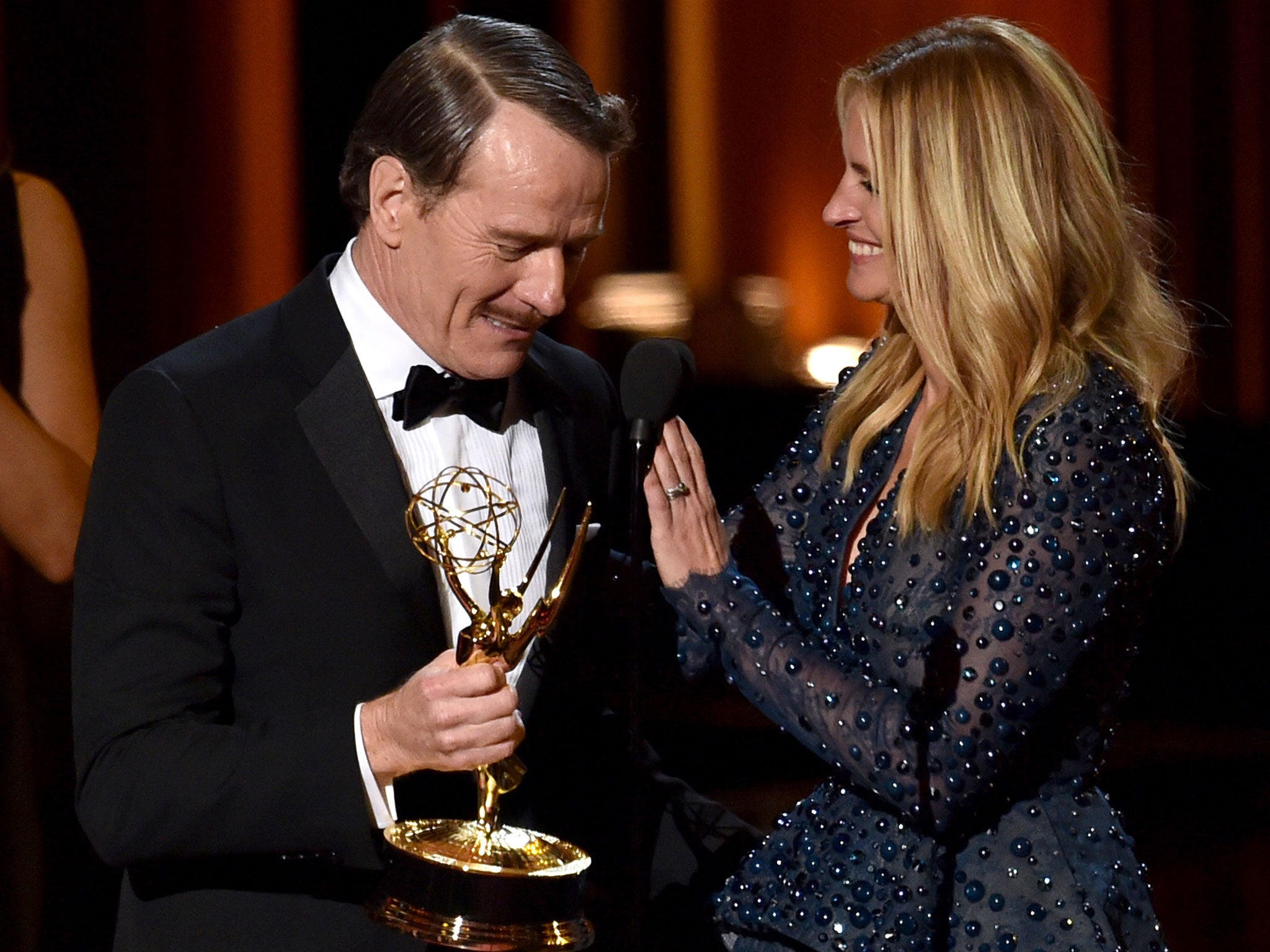 Actor Bryan Cranston (L) accepts Outstanding Lead Actor in a Drama Series for 'Breaking Bad' from actress Julia Roberts onstage at the 66th Annual Primetime Emmy Awards held at Nokia Theatre L.A. Live on August 25, 2014.