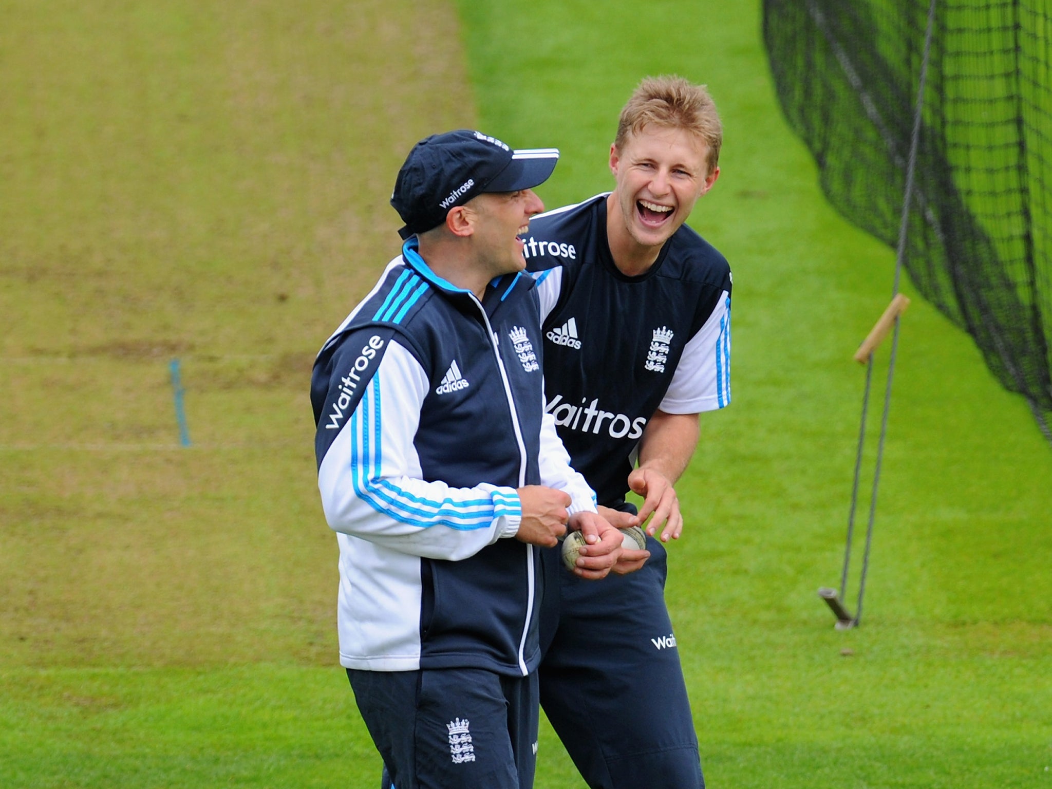 England players James Tredwell (l) and Joe Root share a joke during England practice