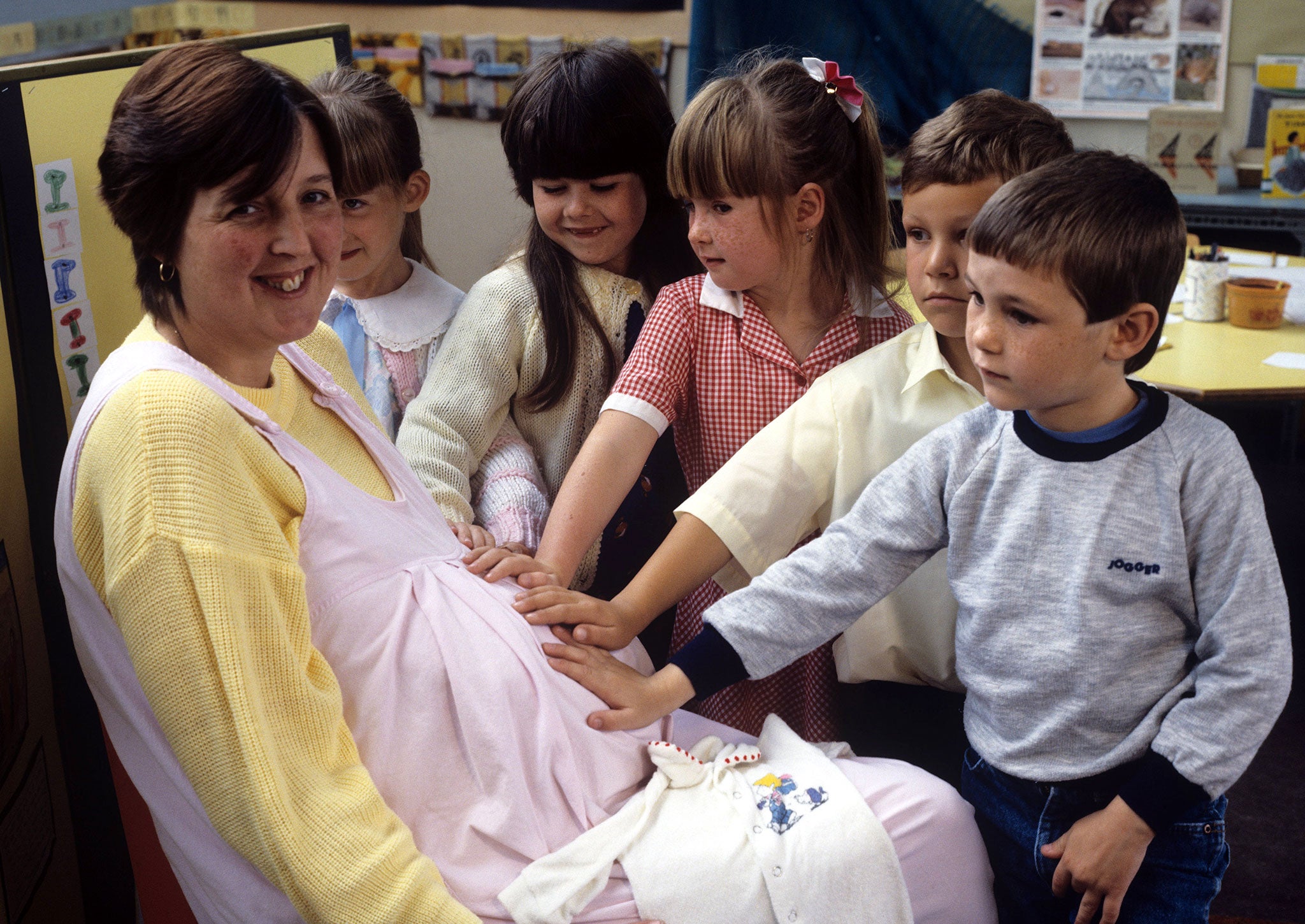 A group of primary school children learn about where babies come from