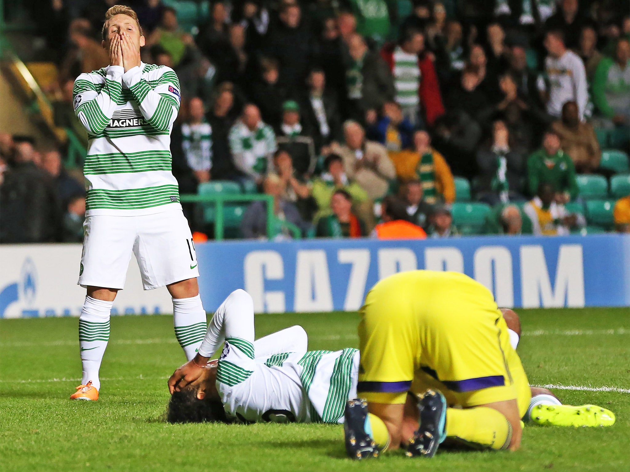 Celtic players are distraught after missing out on qualification