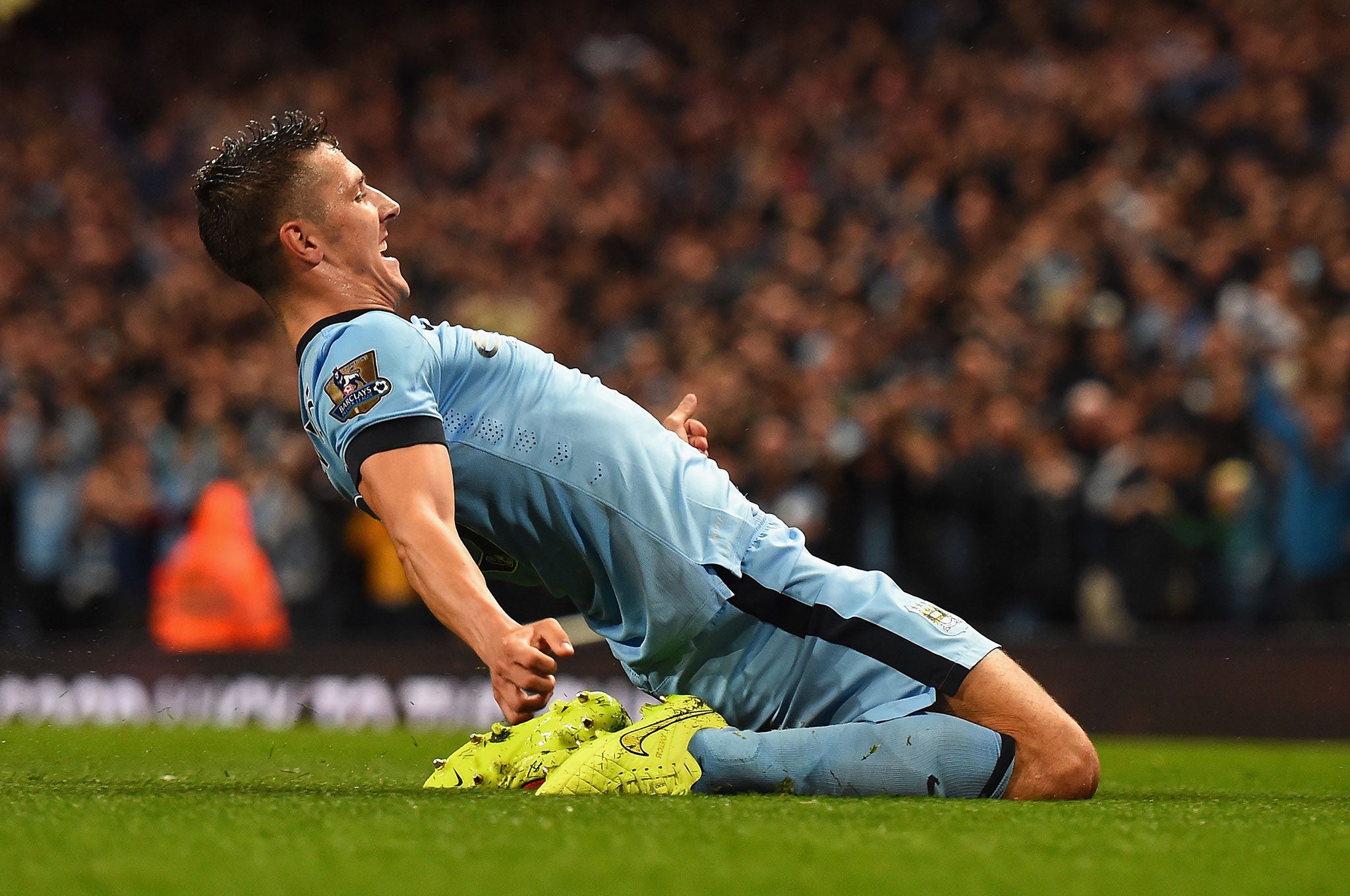 Stevan Jovetic of Manchester City celebrates scoring the opening goal during the Barclays Premier League match between Manchester City and Liverpool at the Etihad Stadium in Manchester, England