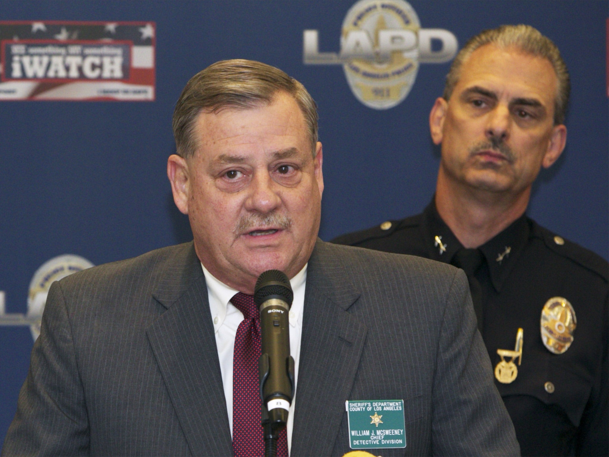 Bill McSweeney, Los Angeles County Sheriff's Department Chief Detective, left, with Los Angeles Police Department Deputy Chief Kirk Albanese, speak to the media in Los Angeles