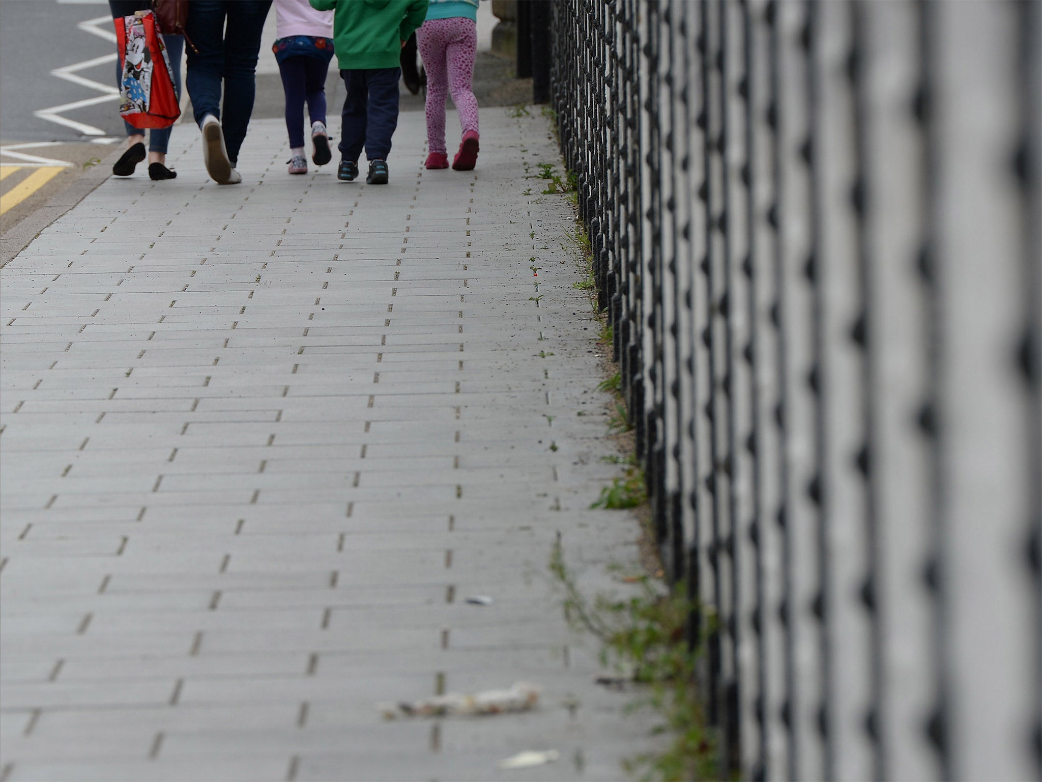 Children walk down a street in Rotherham, South Yorkshire