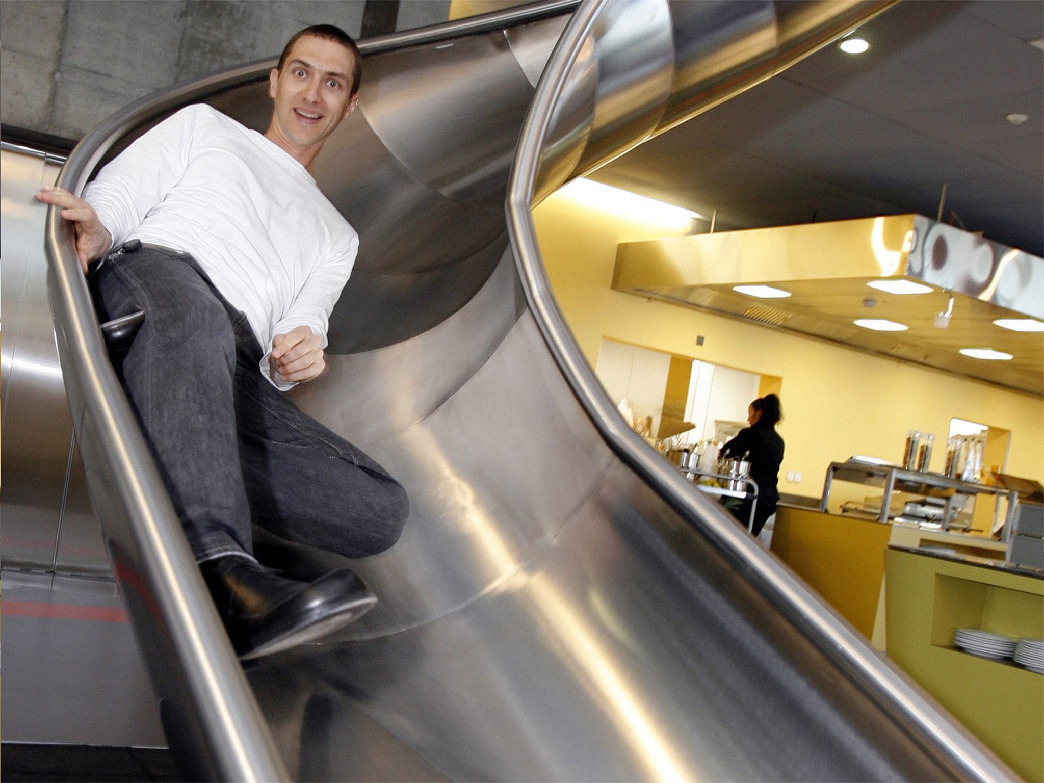 Down time: an employee of Google uses the slide to get to the canteen