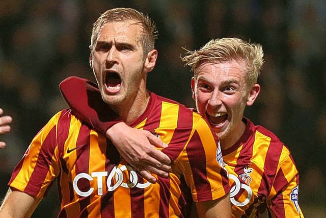 James Hanson (left) celebrates the winner for Bradford City after three late goals in four minutes saw them come from behind to beat Championship side Leeds