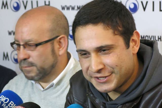 Chilean sailor Mauricio Ruiz, right, reveals he is gay during a press conference in Santiago