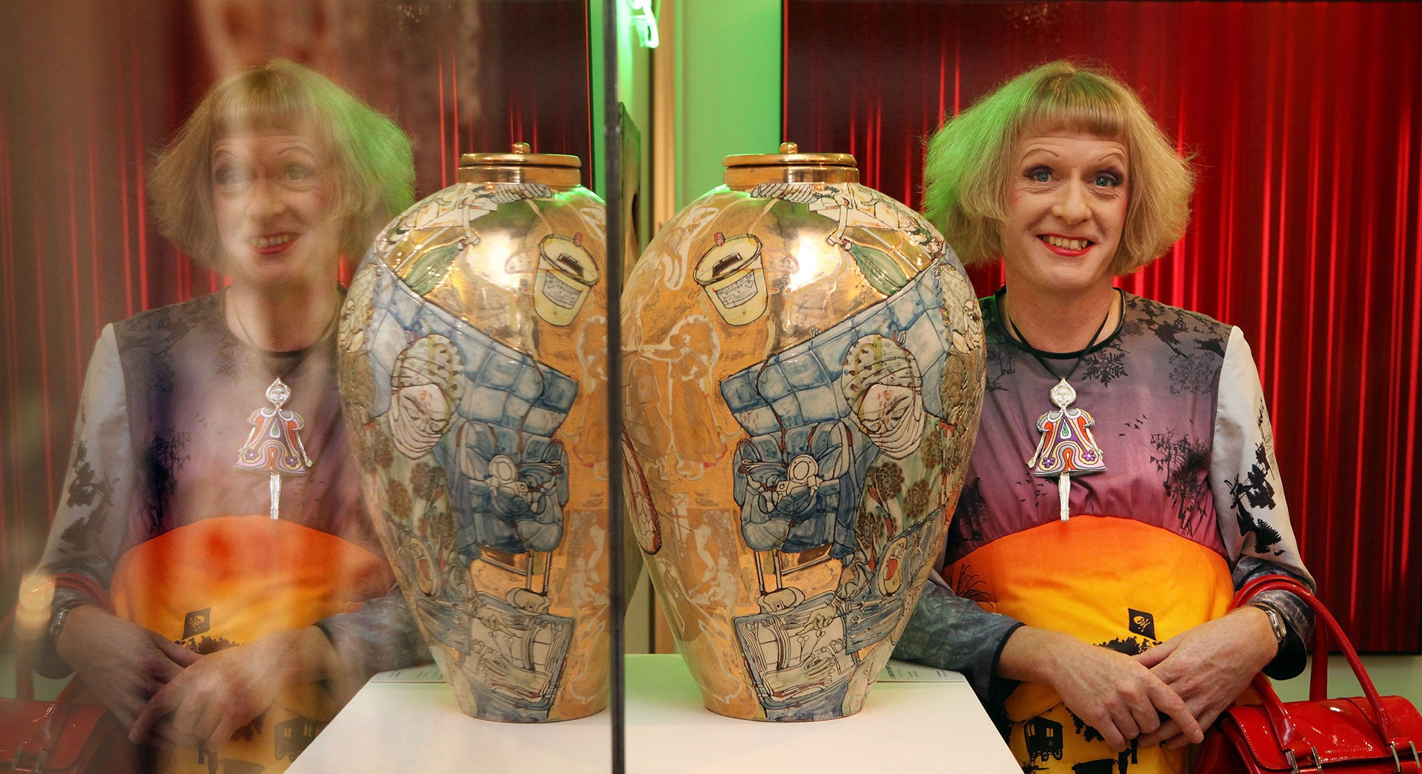 Cheeky chappie approach: Grayson Perry poses with his artwork in 2009