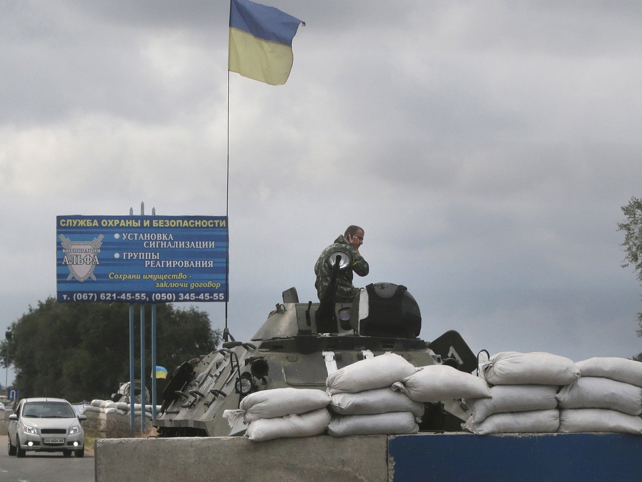 Ukrainian forces guard a checkpoint in the town of Mariupol, eastern Ukraine, which pro-Russian separatists claim is a major target in their rebellion against the government