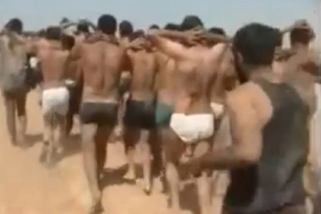 A video uploaded to social networks yesterday shows men in underwear being marched barefoot in the desert