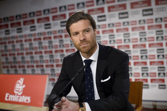 Xabi Alonso looks on at his press conference at the Bernabeu