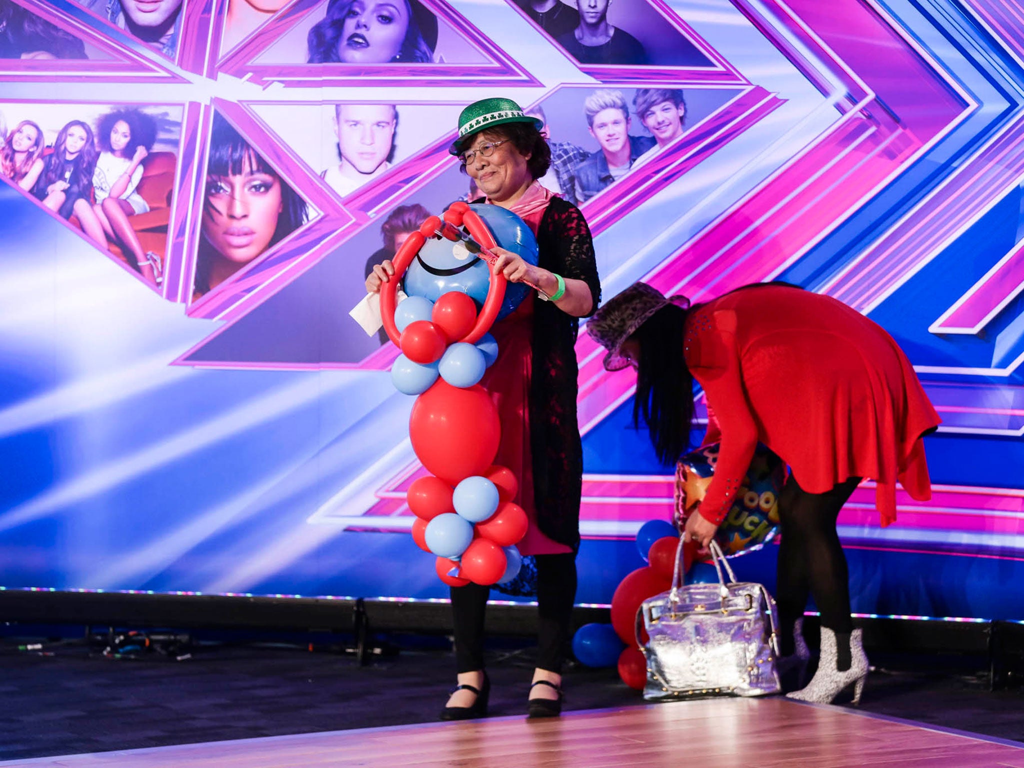 Angelina Robinson (in red) and her Mum prepare for their audition