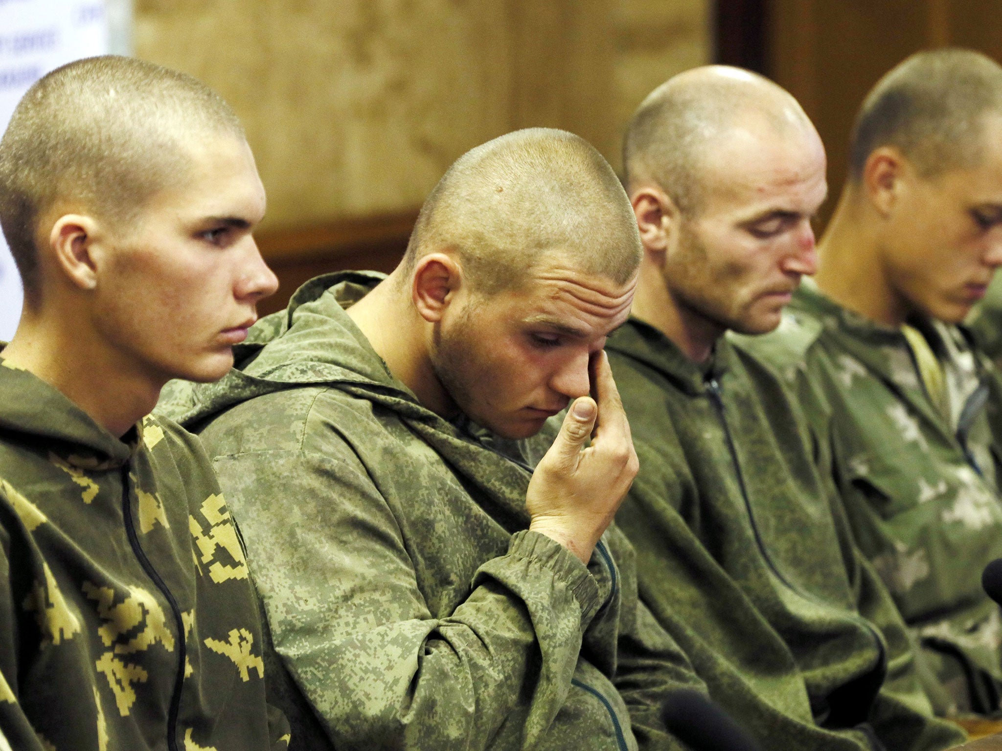 Russian paratroopers captured by Ukrainian forces are put on show at a press
conference in Kiev
