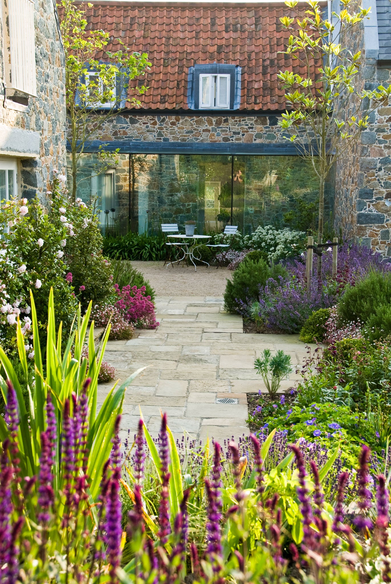 Debbie Roberts' courtyard garden in Guernsey makes the most of relaxed, lush planting