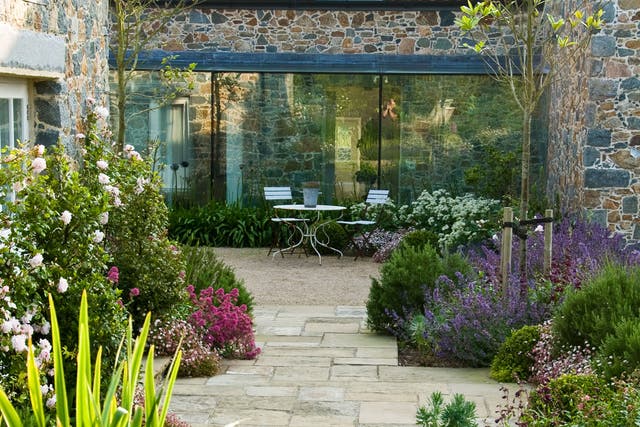Debbie Roberts' courtyard garden in Guernsey makes the most of relaxed, lush planting