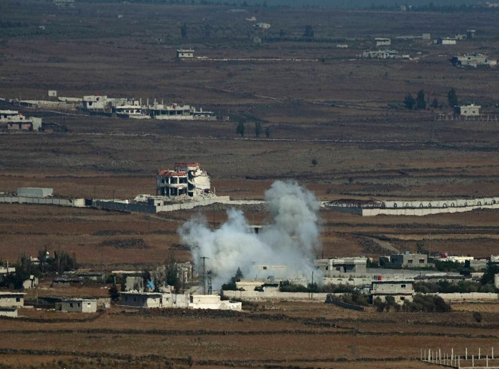 Smoke from an explosion billows from the Syrian-controlled portion of Golan Heights on 29 August