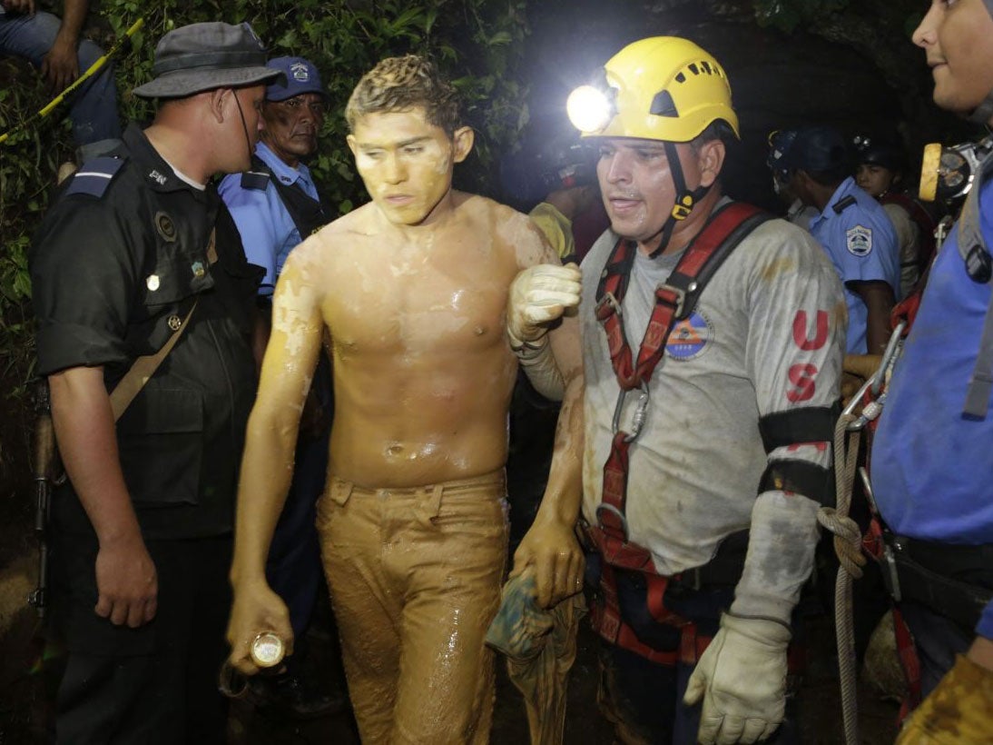 A rescued miner is evacuated from the El Comal gold and silver mine