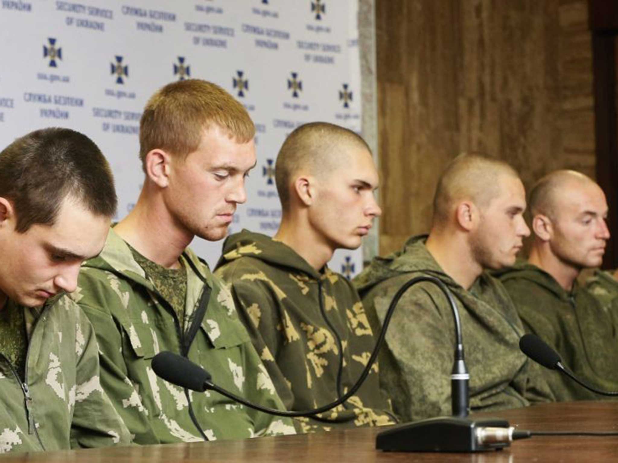 Captured: Russian paratroopers facing the press in Ukraine on Wednesday