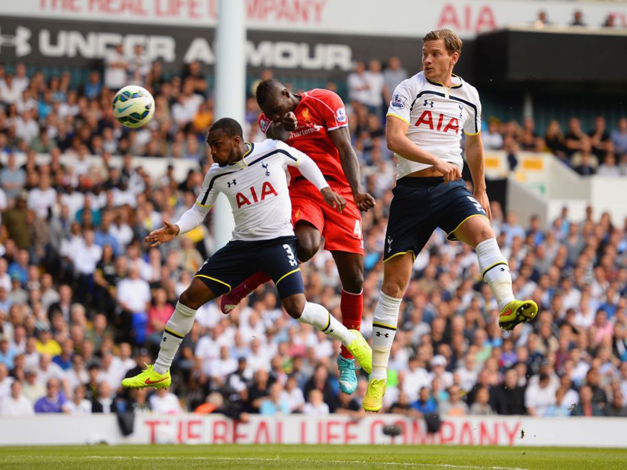 Mario Balotelli has an early header on goal during his Liverpool debut against Tottenham
