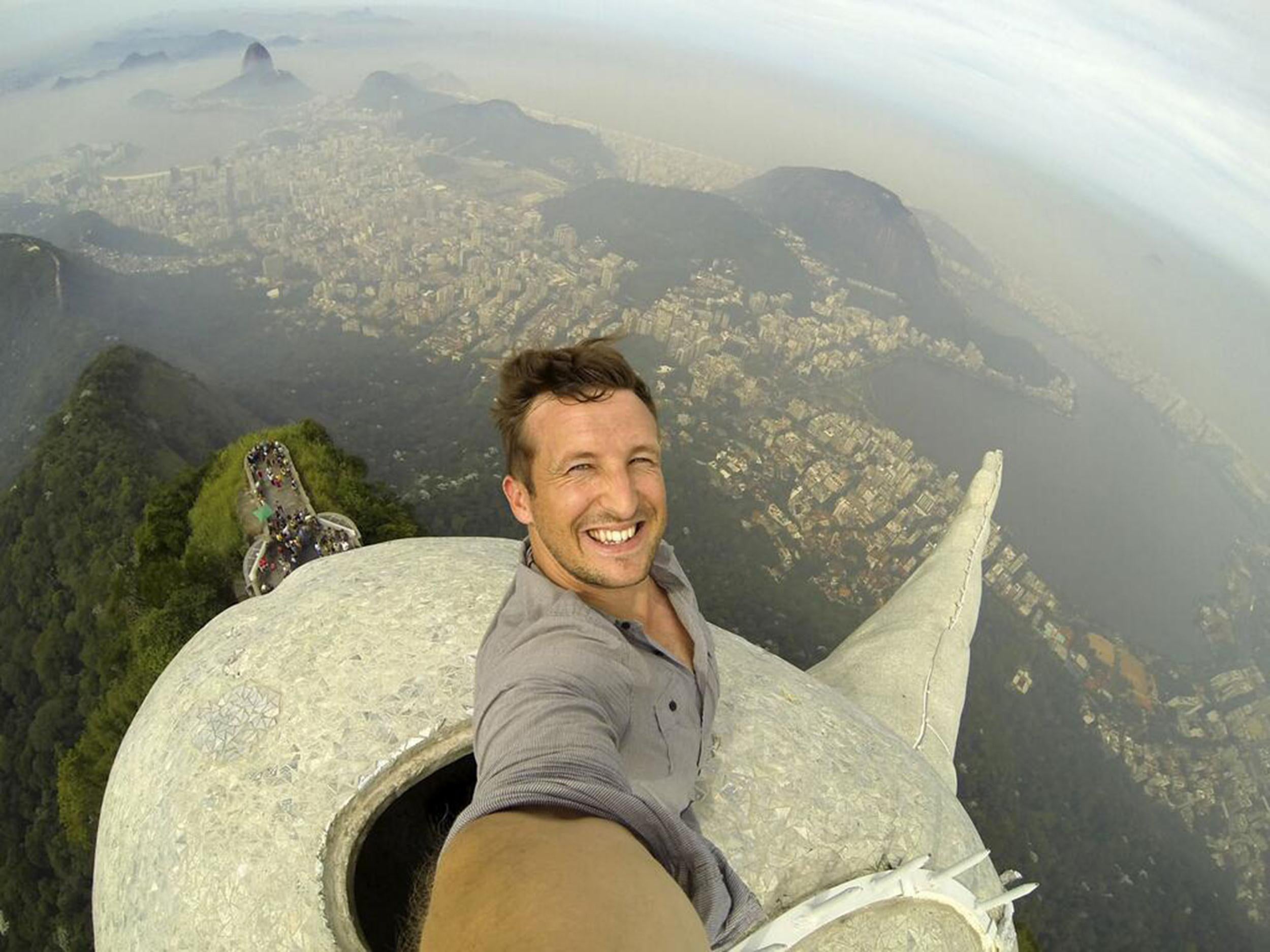 Lee Thompson takes selfie atop the Christ the Redeemer statue in Rio de Janeiro, Brazil