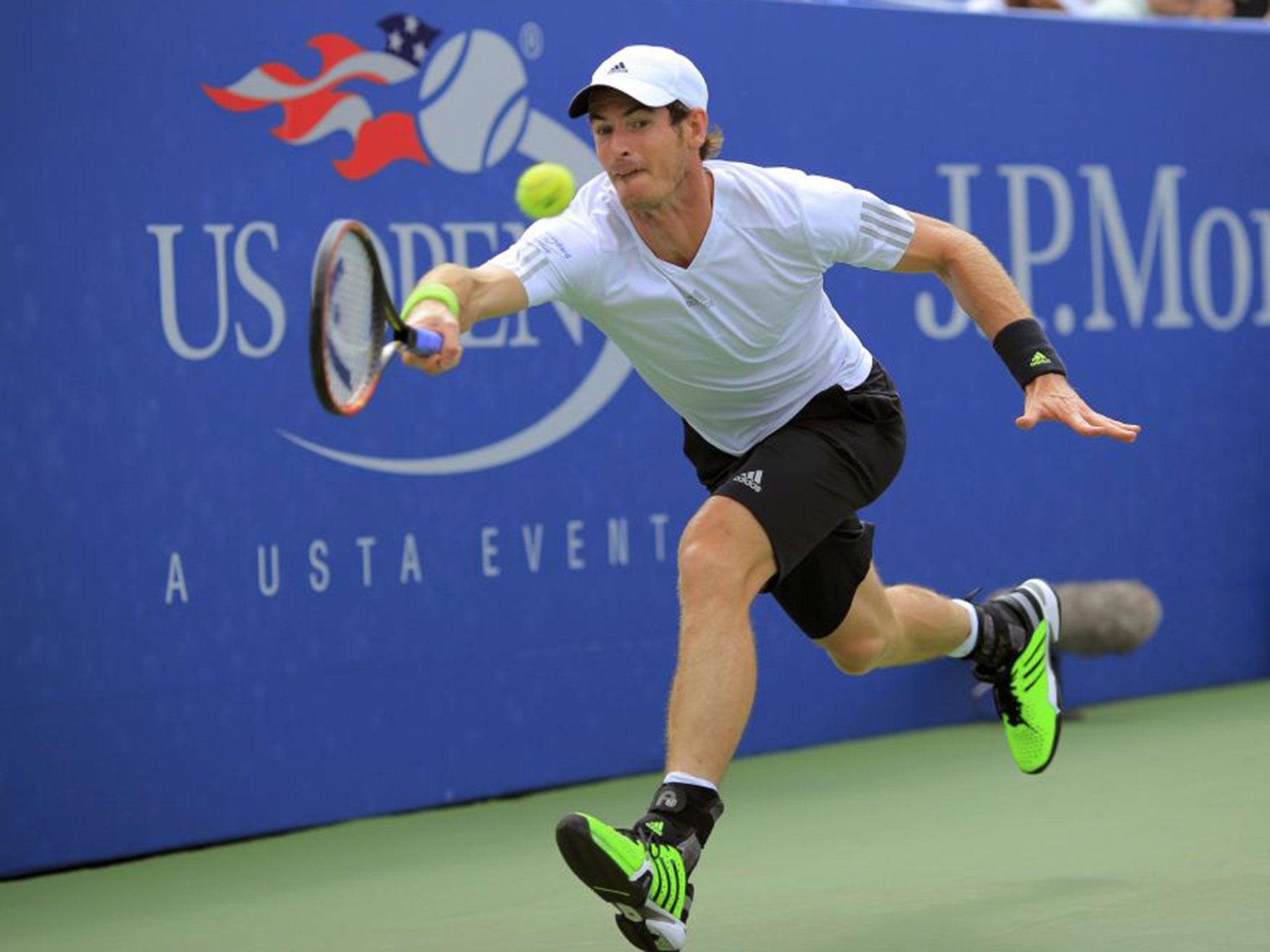 Andy Murray hits a return during his win over Andrey Kuznetsov