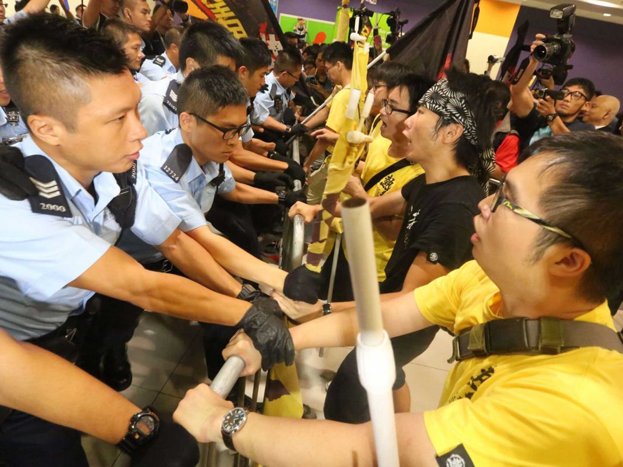 Pro-democracy protesters clashing with police officers outside the Hong Kong government complex