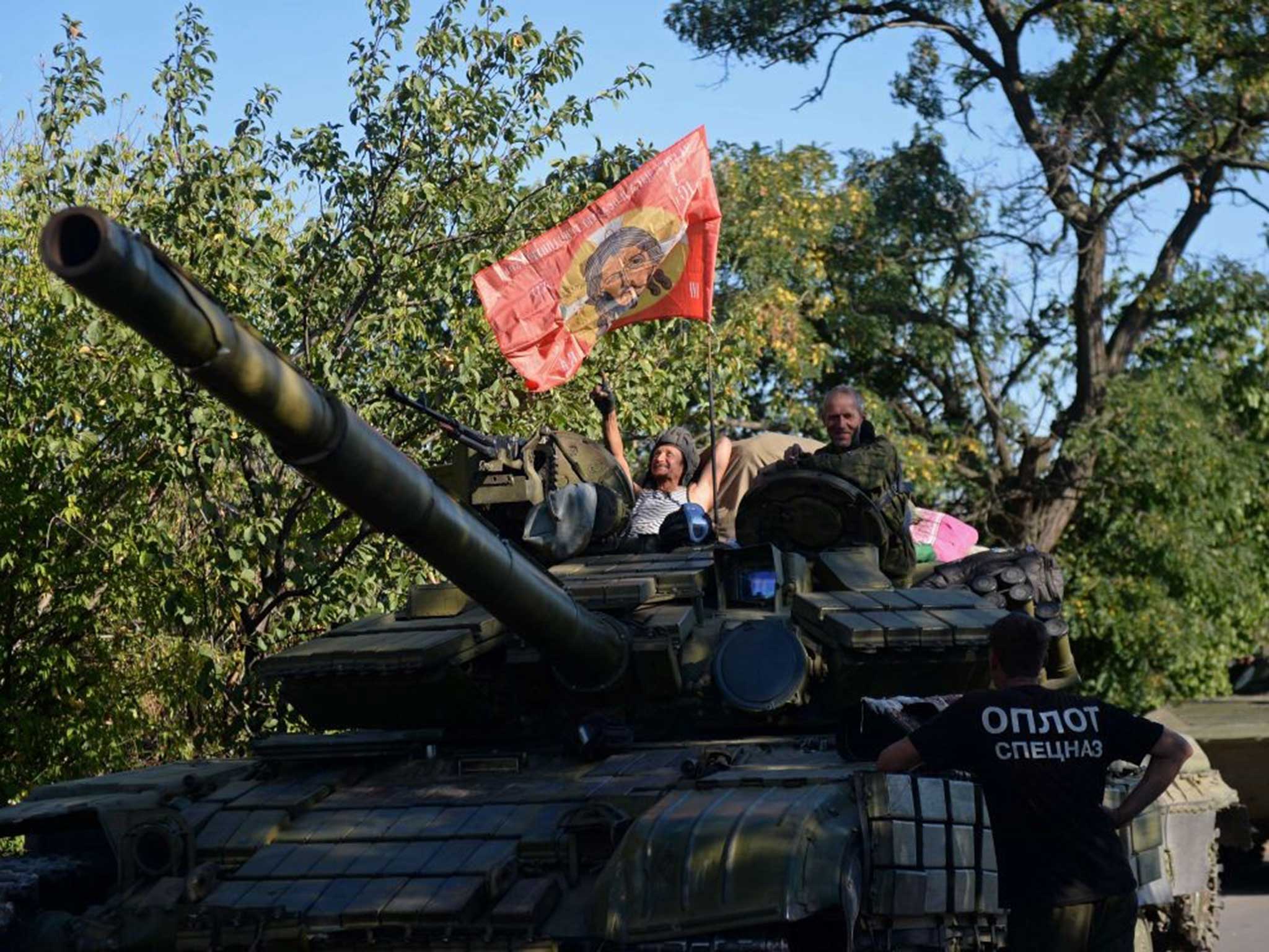 A Russian fighter atop a tank, photographed yesterday southeast of Donetsk