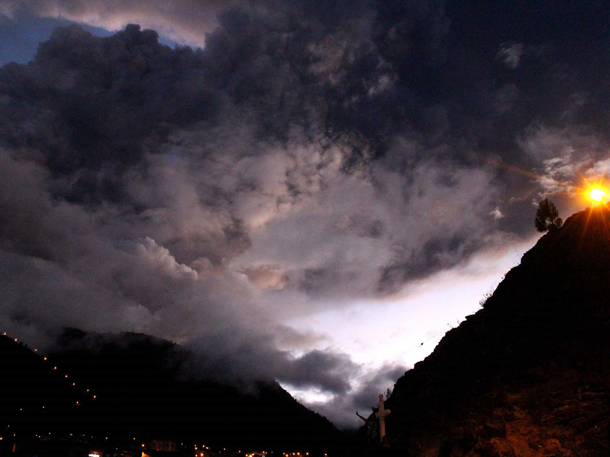 The Tungurahua volcano erupting is seen from Banos, Ecuador on April 4, 2014