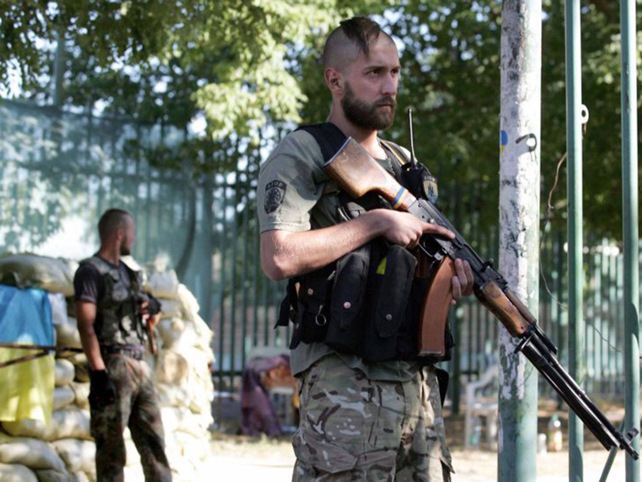 Ukrainian soldiers from the 'Azov' battalion guard their base in Mariupol, Donetsk