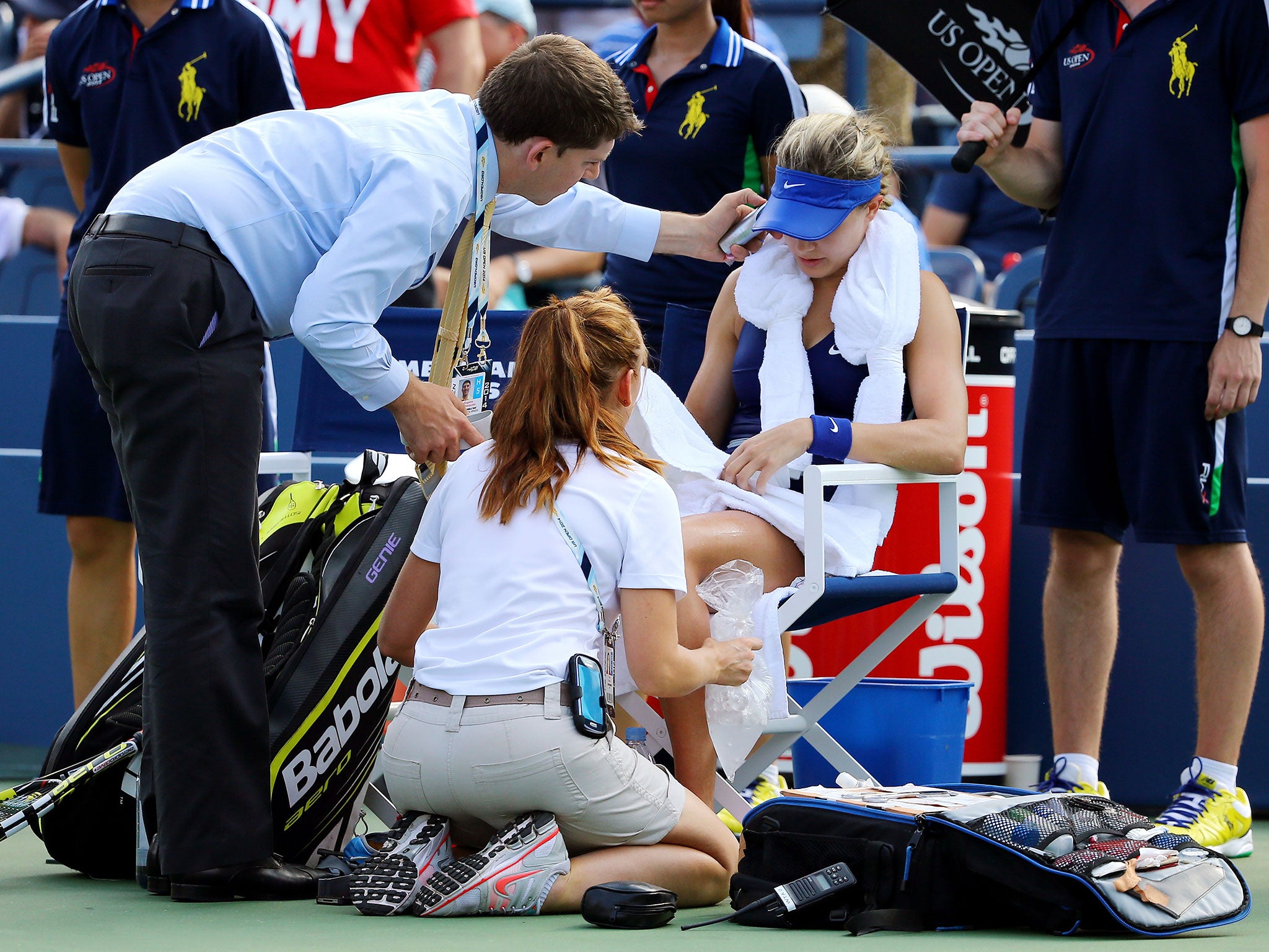 Bouchard receives medical attention during her defeat to Makarova