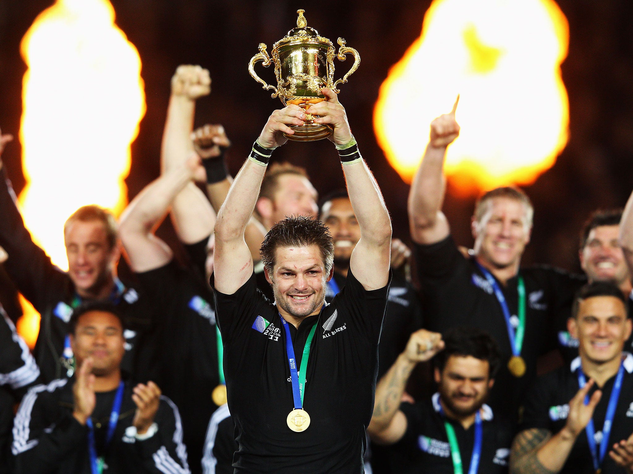 Richie McCaw lifts the World Cup trophy after success in 2011