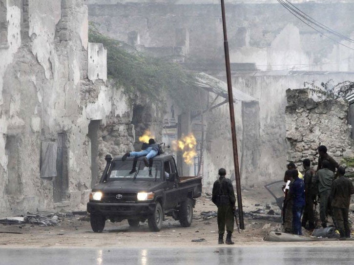 A Somali government soldier fighting militants during an attack at a national security compound in Mogadishu on 31 August