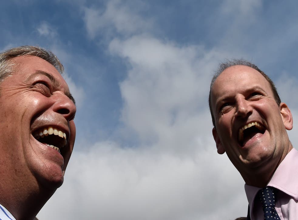 Douglas Carswell (r) and Nigel Farage (l) walk through the town centre of Clacton-on-Sea in south east England on 29 August 2014