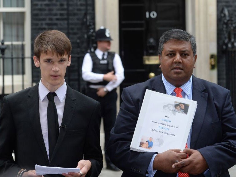 Ethan Dallas and Sanjay Ganatra, friends of the family, deliver a petition of over 100,000 names calling for his parents' release from a Spanish jail