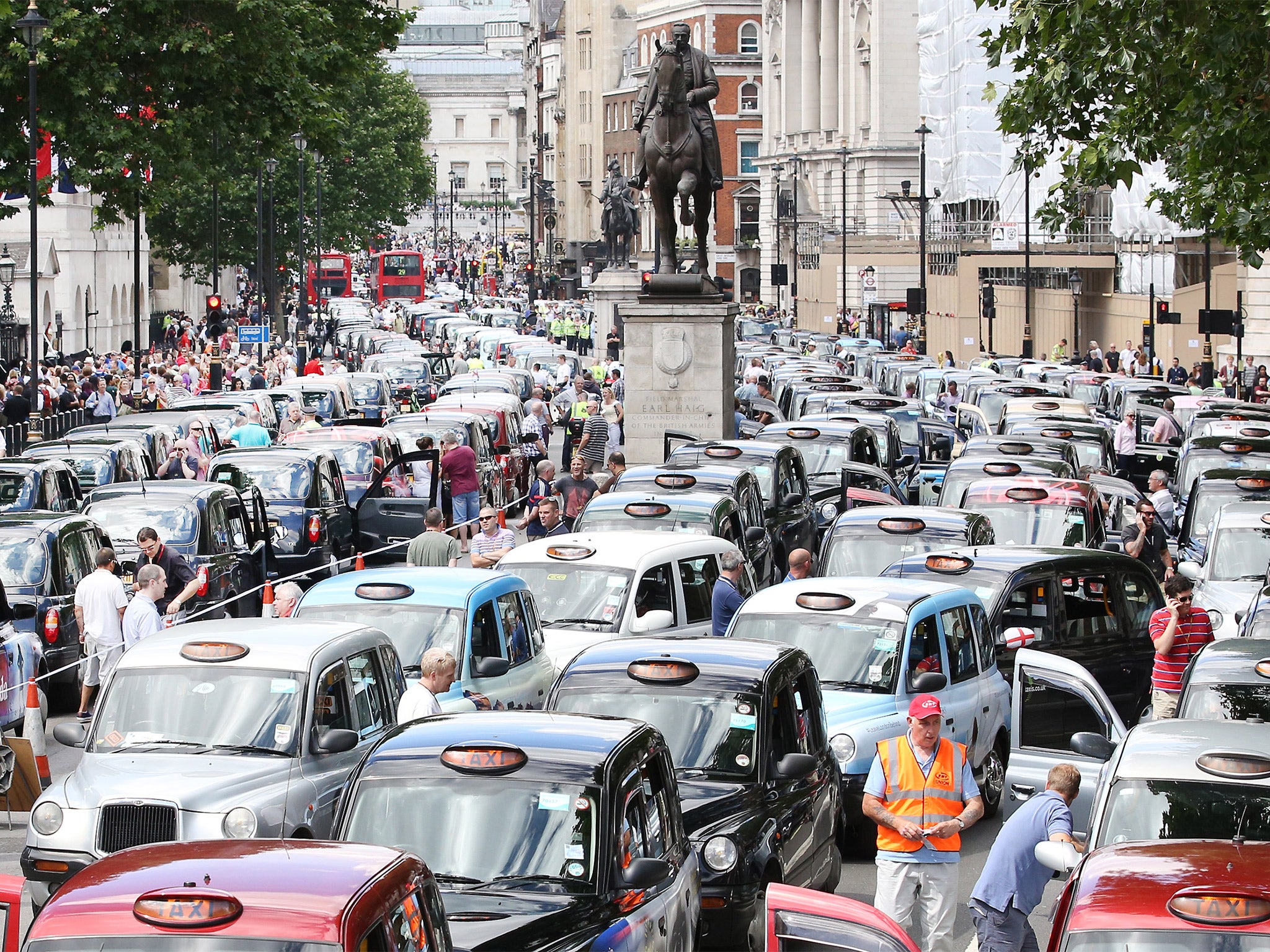 Black cab and licensed taxi drivers protest at Trafalgar Square, London over phone app Uber, in June