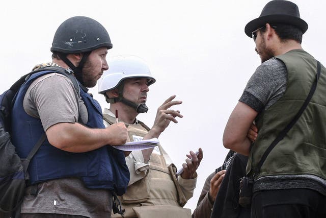 Journalist Steven Sotloff, left, pictured in Libya in 2011