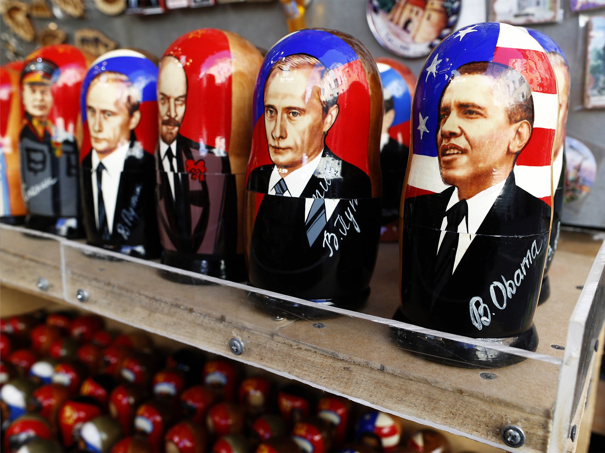 Russian wooden dolls depicting Barack Obama and Vladimir Putin displayed in Estonia. The US President is under pressure to take action against his Russian counterpart