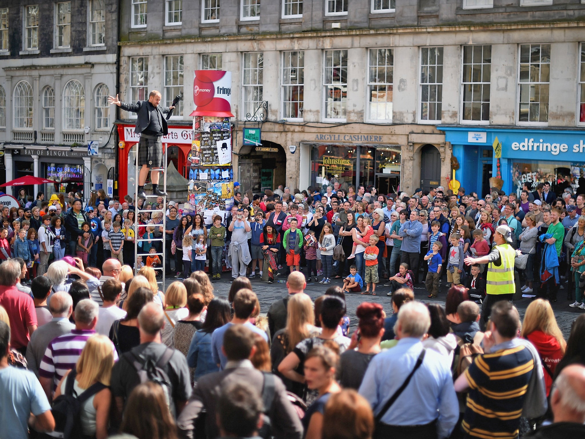 Edinburgh Festival Fringe entertainers perform on the Royal Mile in Edinburgh, last month