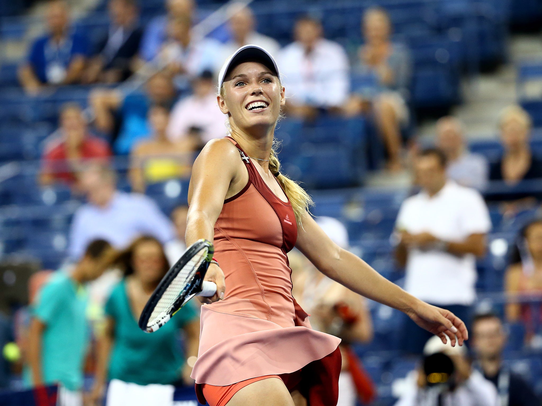 Caroline Wozniacki of Denmark celebrates after defeating Sara Errani of Italy in their women's singles quarter-final