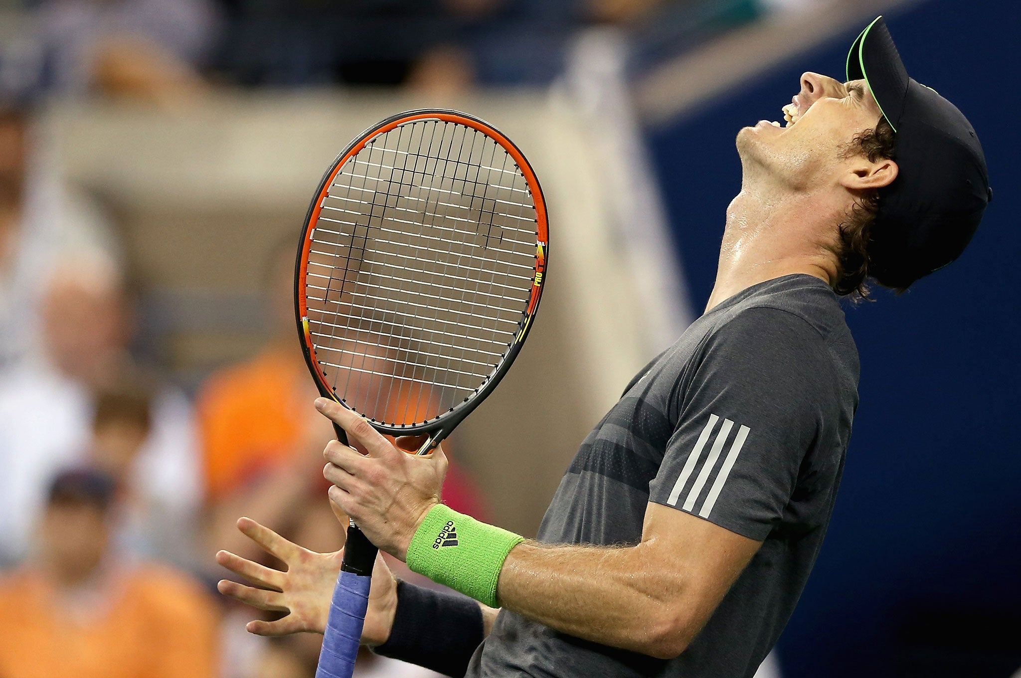 Andy Murray of Great Britain reacts against Novak Djokovic of Serbia during their men's singles quarterfinal match on Day Ten of the 2014 US Open