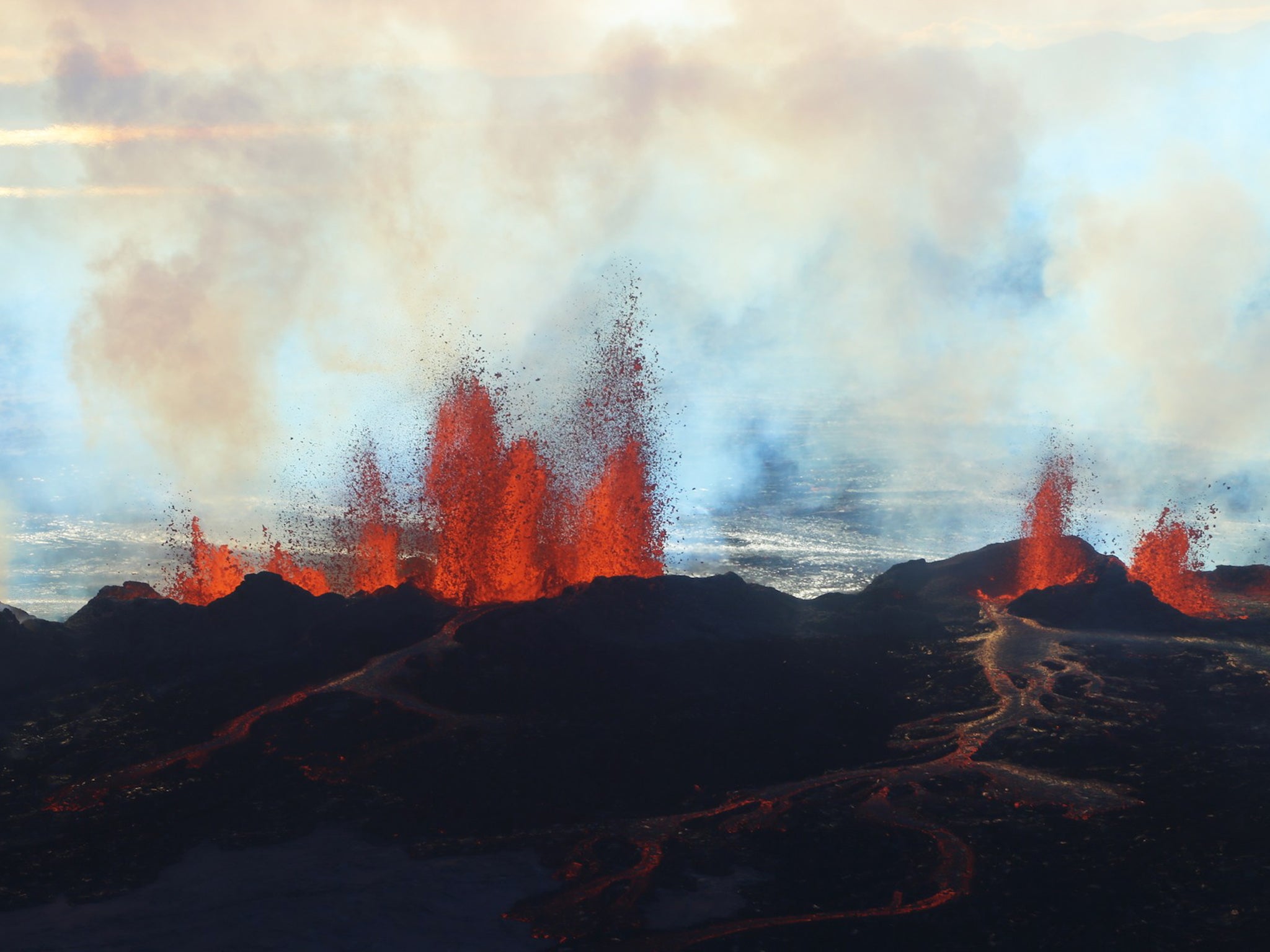 In this aerial view, fountains of lava, up to 60 meters high, spurt from a fissure in the ground on the north side of the Bardarbunga volcano in Iceland. The alert warning for the area surrounding Iceland's Bardarbunga volcano remained at orange, indicati