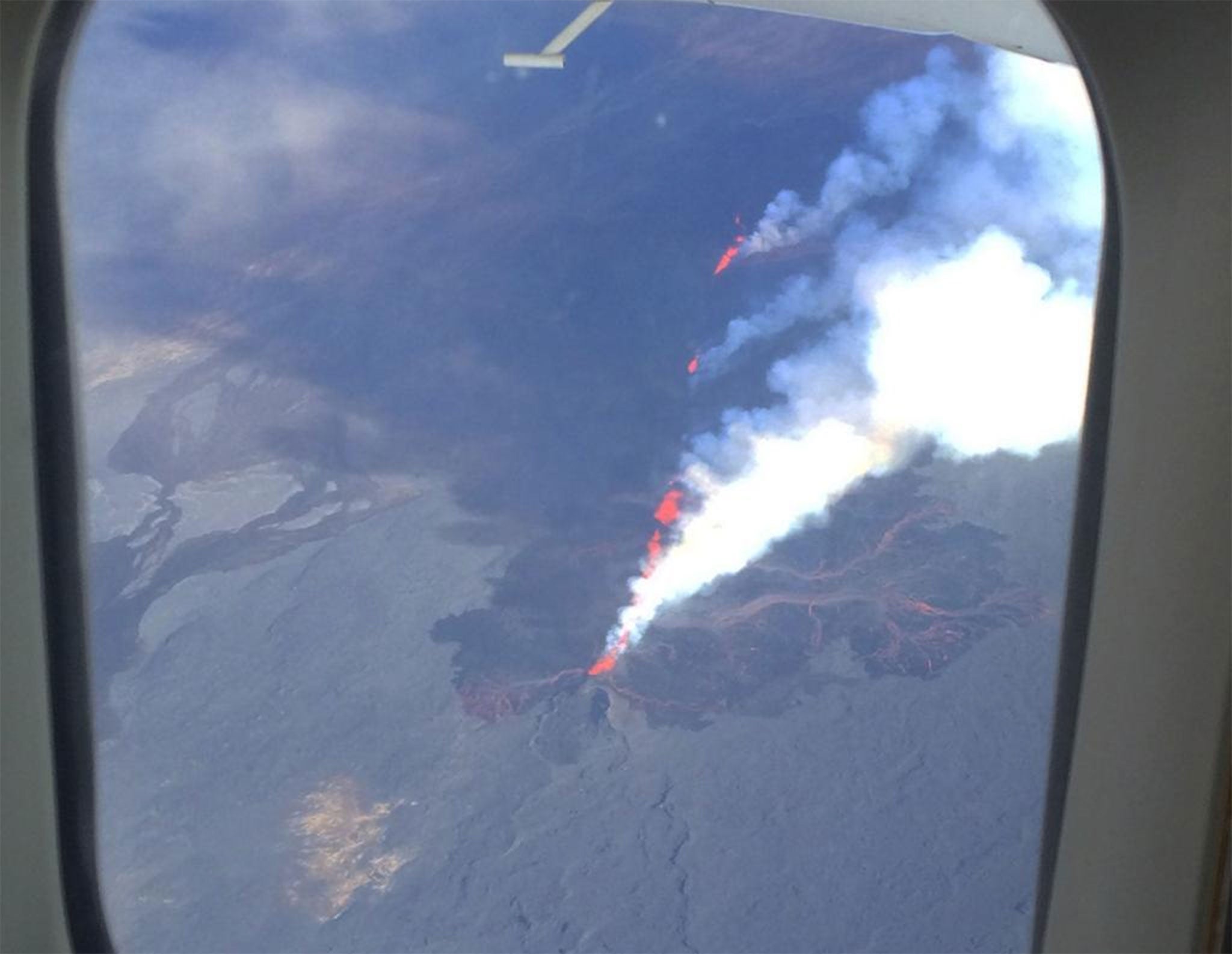 This image was tweeted by Icelandair, showing the view of the volcano from one of its planes