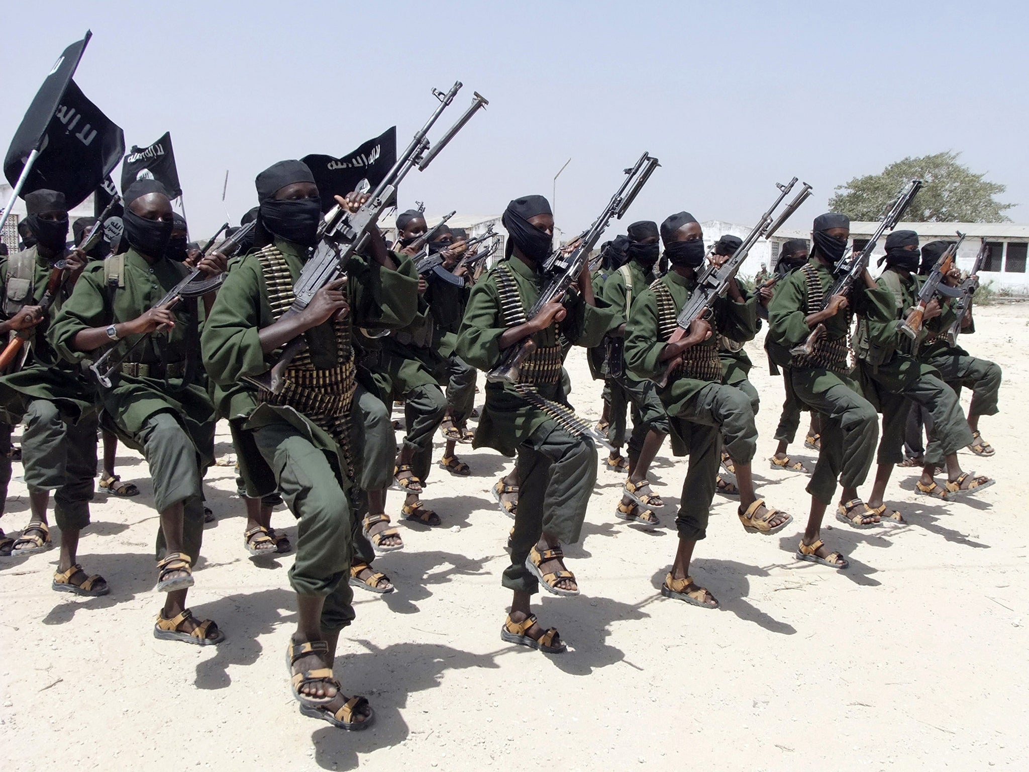Hundreds of newly trained al-Shabab fighters perform military exercises
