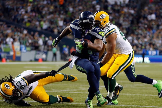 Marshawn Lynch evades the Green Bay defence to run in for one of two touchdowns