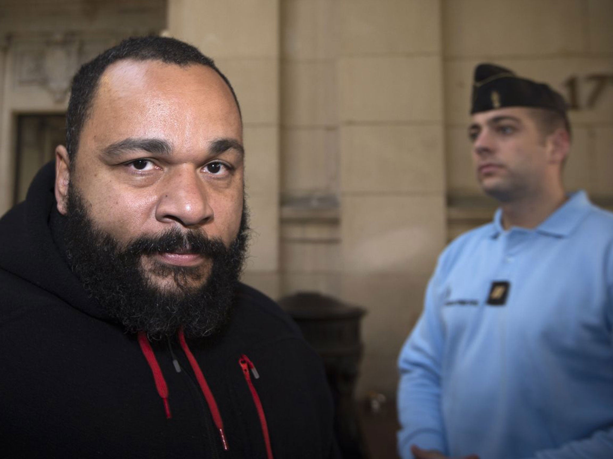 French humorist Dieudonne Mbala Mbala arrives for a trial at the Paris courthouse in December