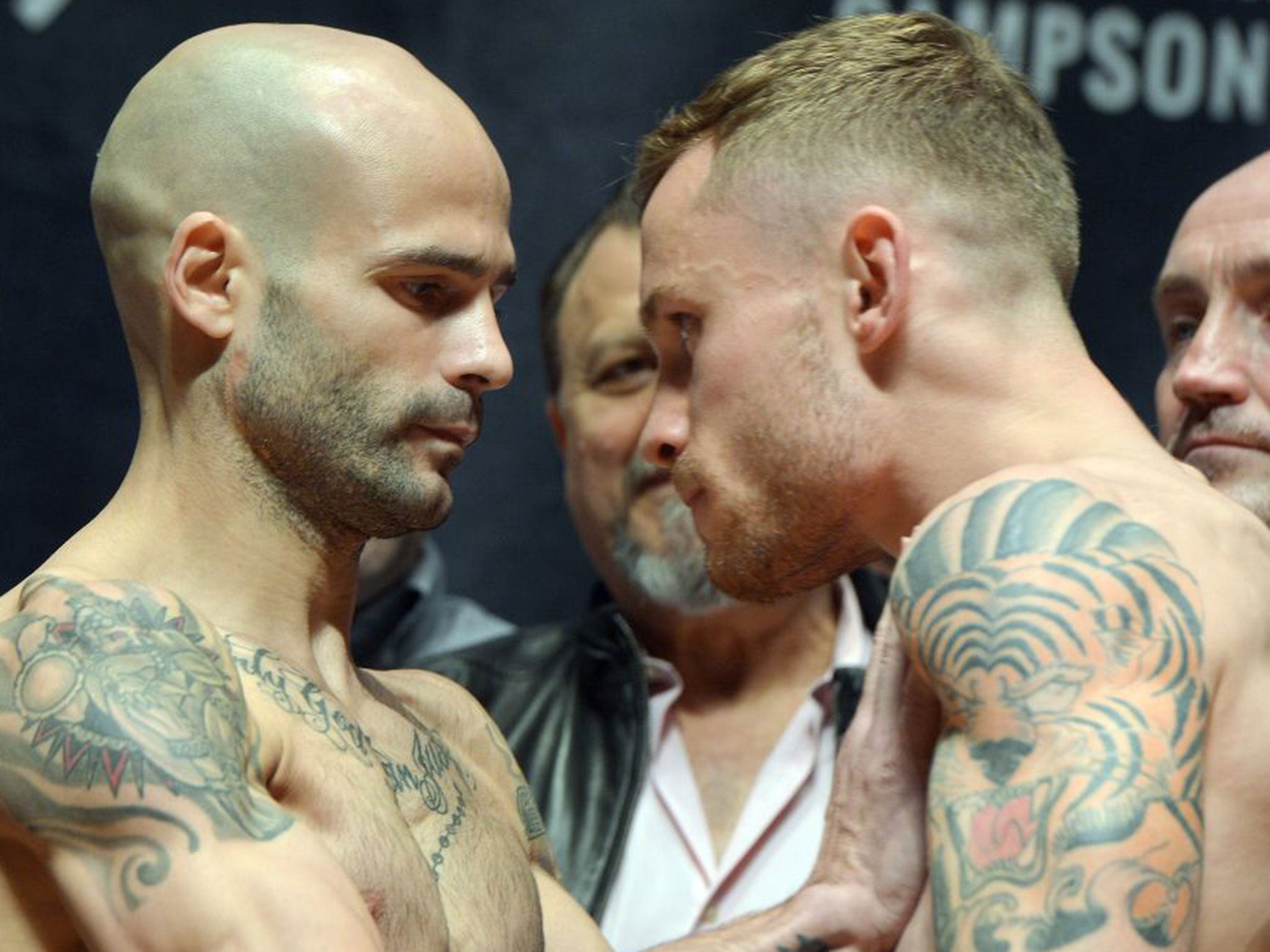 Kiko Martinez (left) and Carl Frampton during the weigh-in on Friday