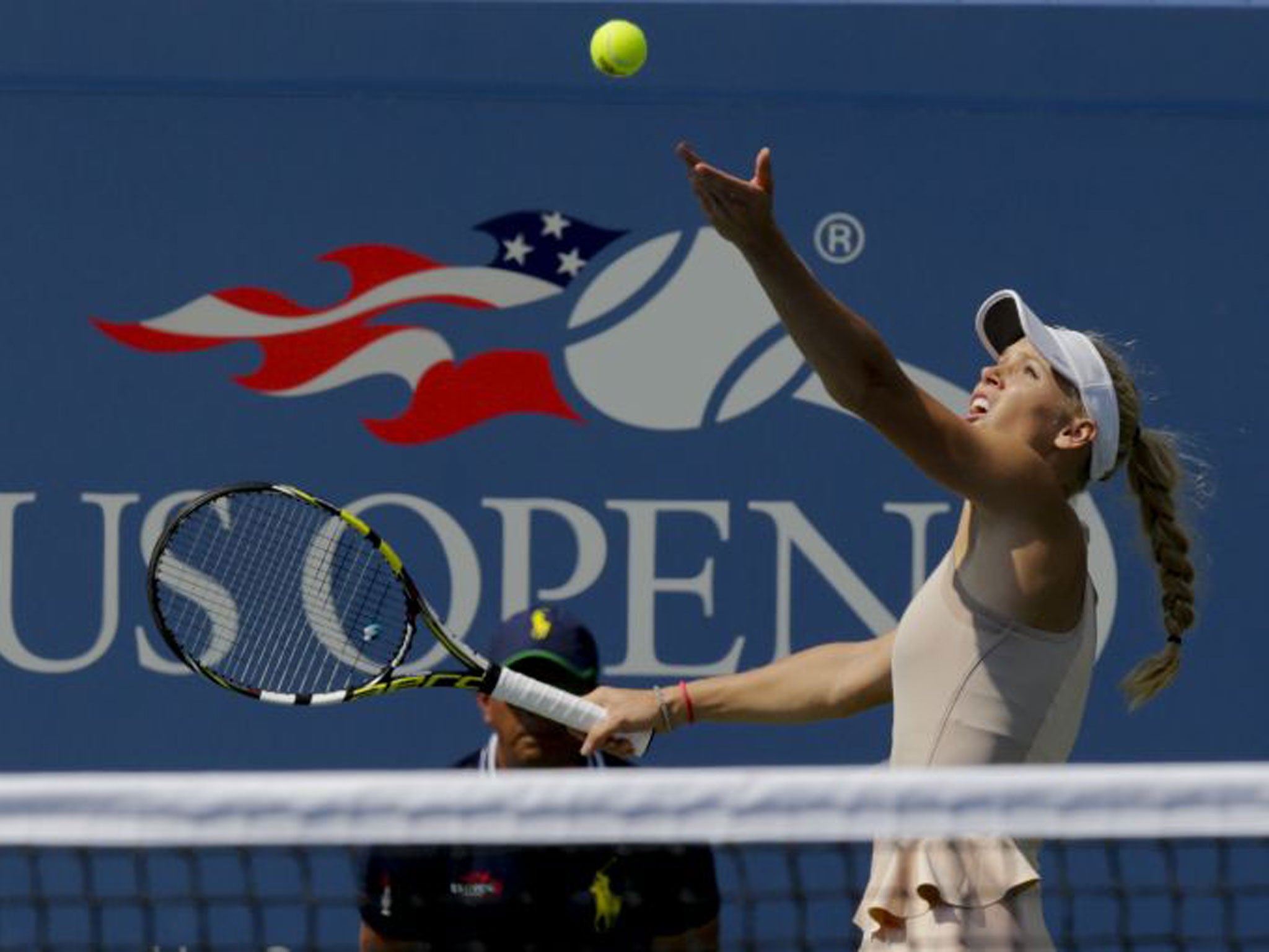 Caroline Wozniacki, of Denmark, serves against Peng Shuai, of China